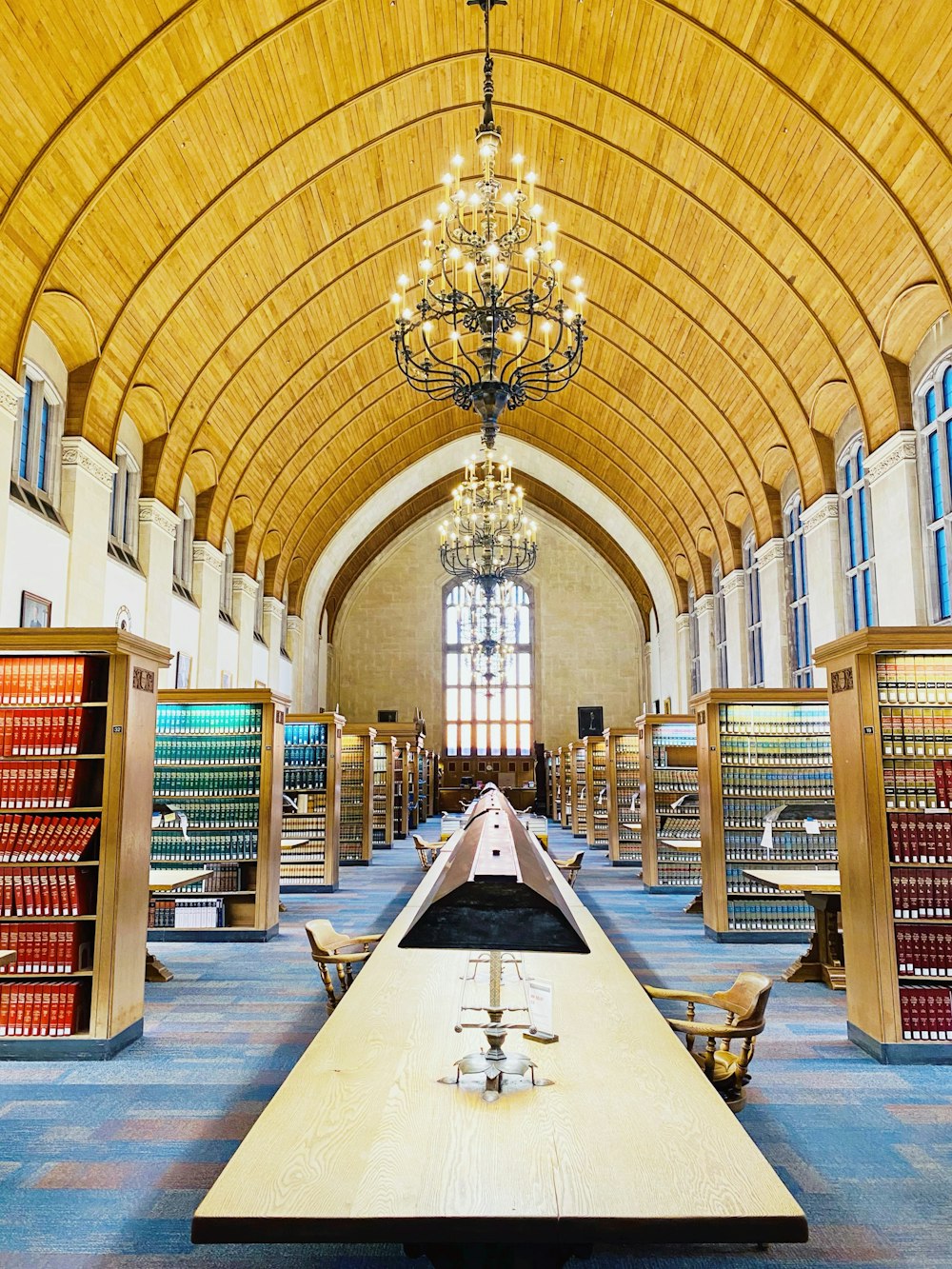 people sitting on chair inside library