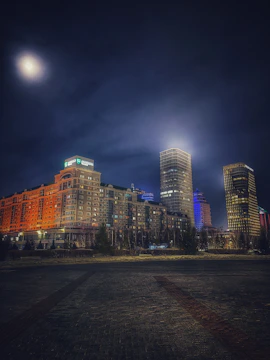 A moody nighttime cityscape filmed with cinematic lighting, emphasizing contrast and depth.