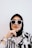 woman in black hijab and white and black long sleeve shirt wearing black sunglasses