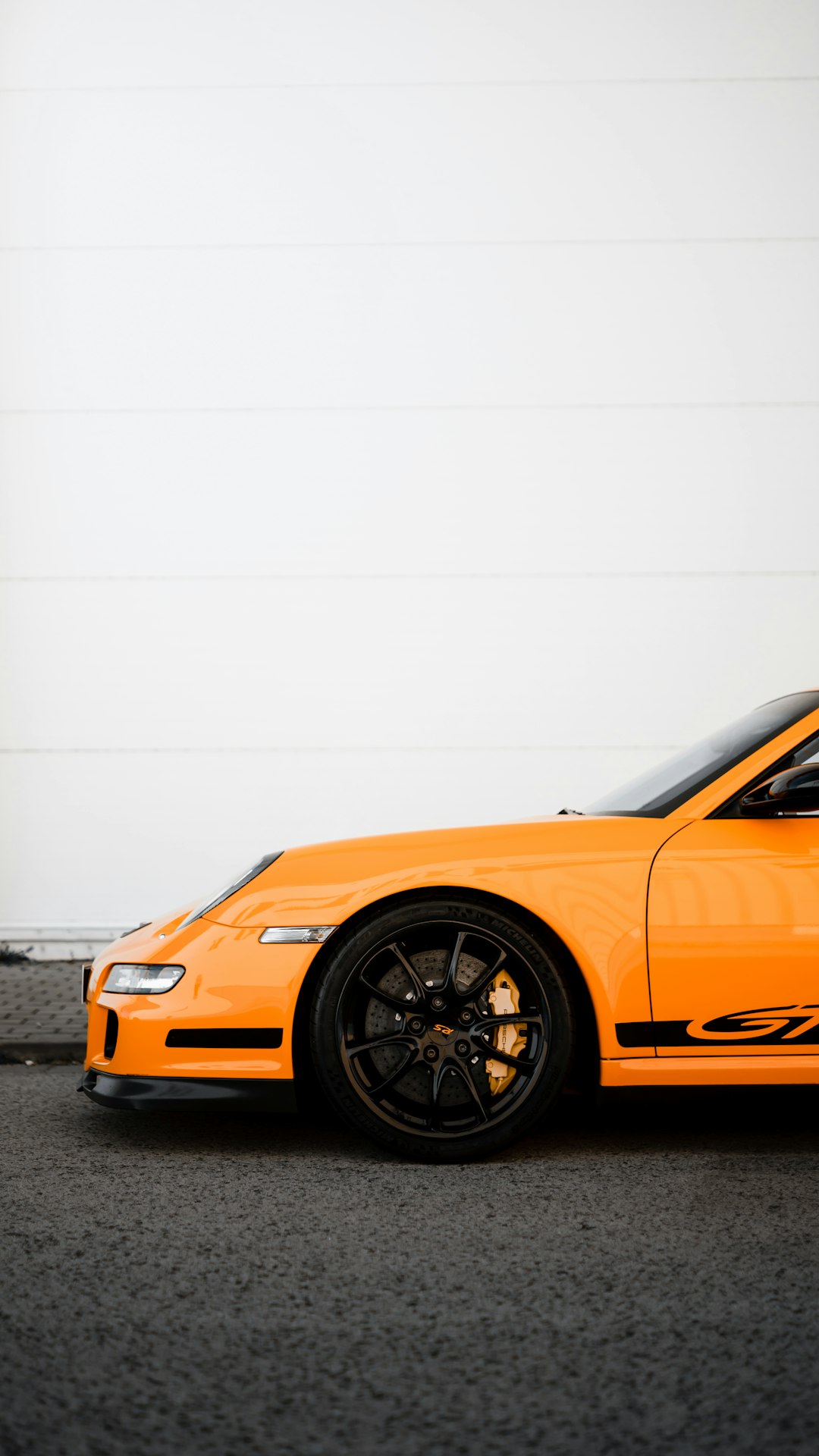 orange ferrari 458 italia on road