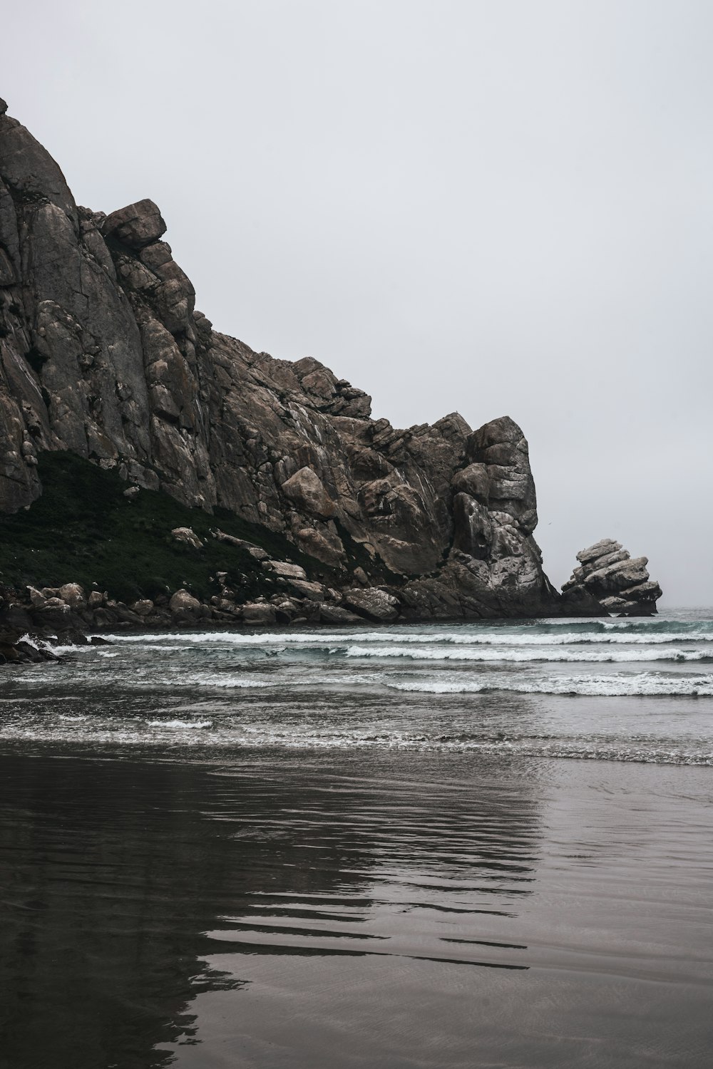 brown rock formation on sea during daytime