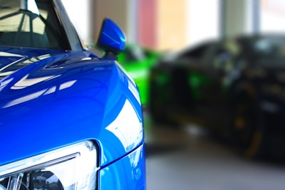 A close-up of a sleek sports car showcasing its vibrant colors.