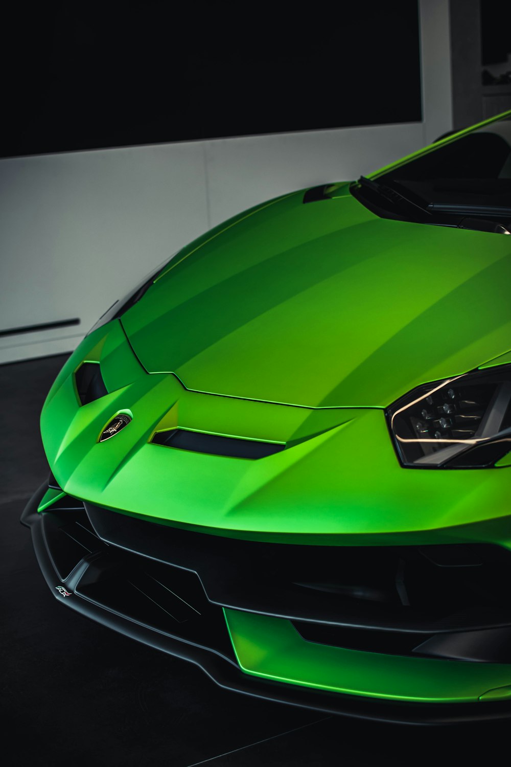 yellow lamborghini aventador in a room