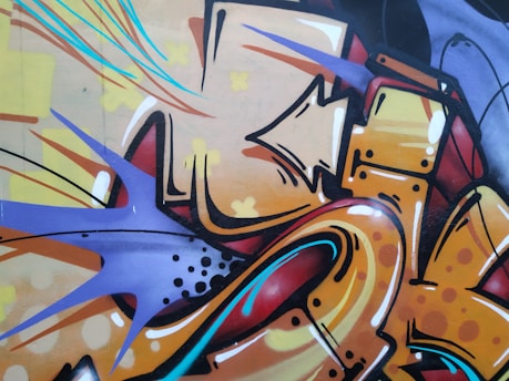 Colorful mural detail showing a vibrant blend of tropical and graffiti art styles from the communication mural project in Cali.