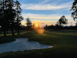 Sunset view over the golf course highlighting the serene and elegant atmosphere of the club.