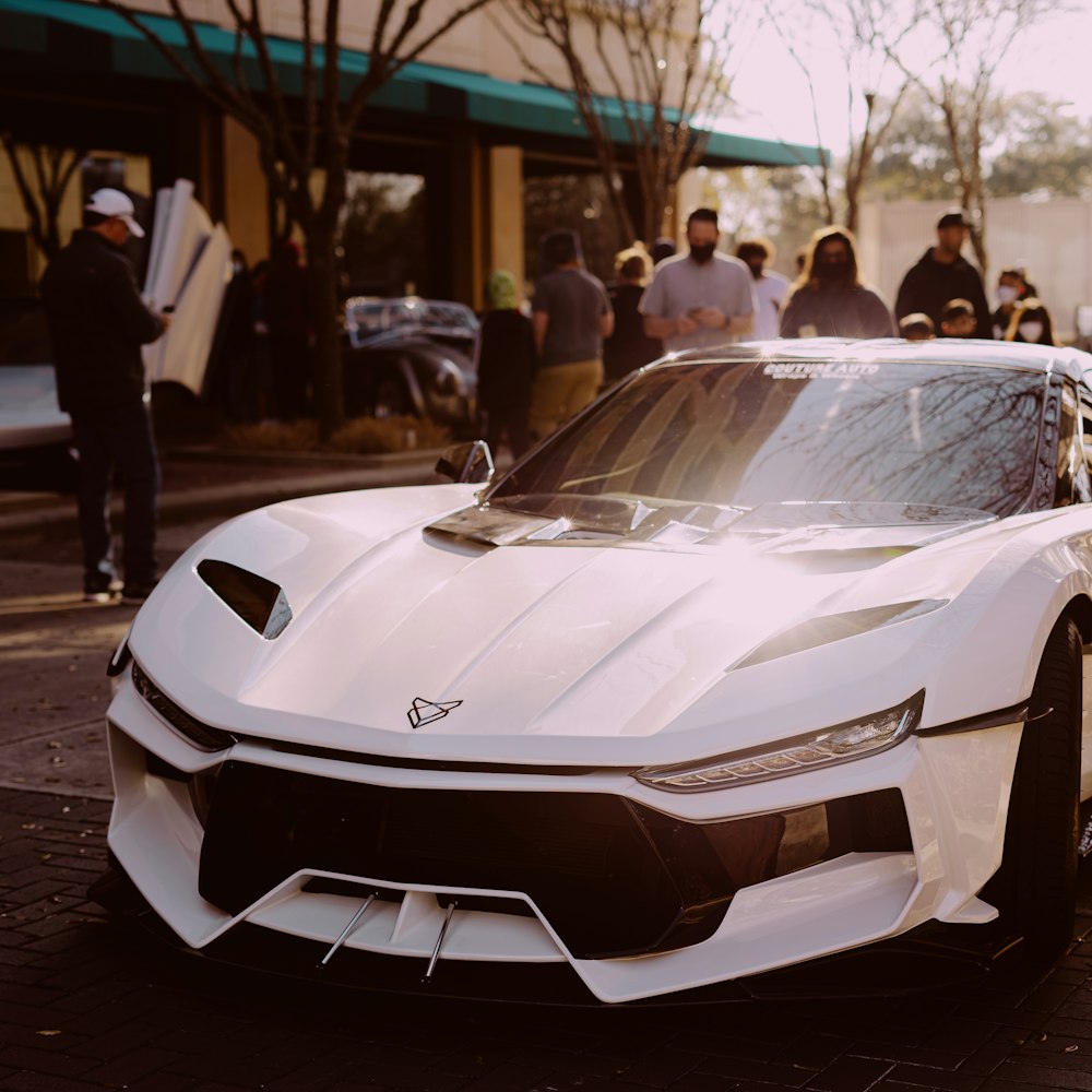 white lamborghini aventador in a city street