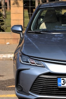 Front view of a Maruti Suzuki Alto, shining bright and inviting on a clear day.