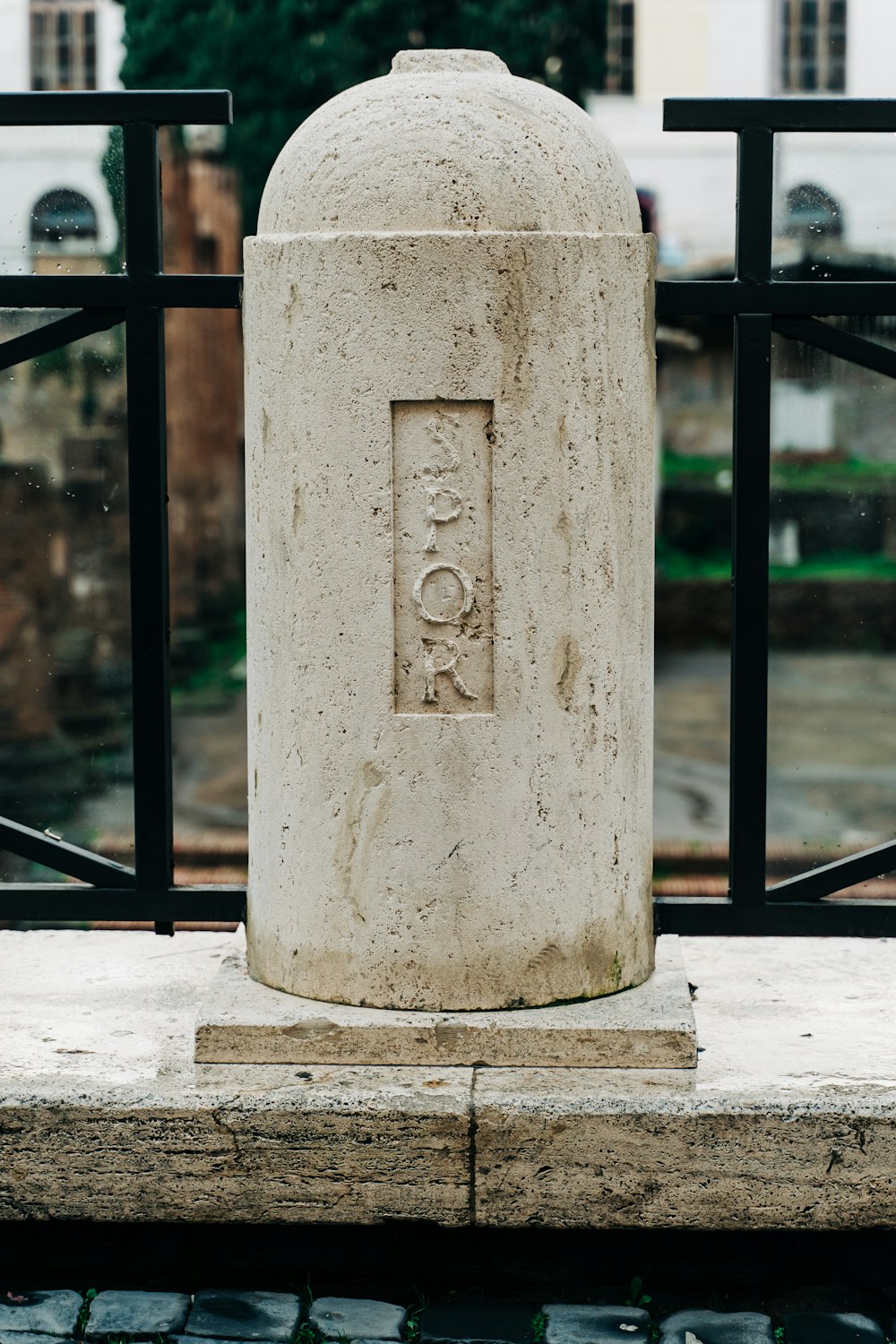 gray concrete post during daytime