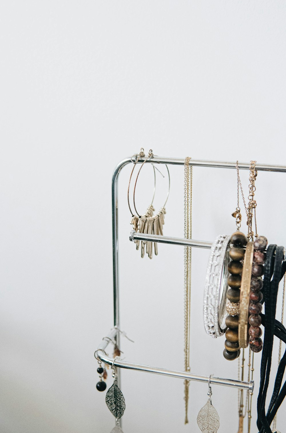 brown wooden clothes hanger on white wall