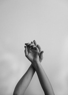 grayscale photo of persons hand