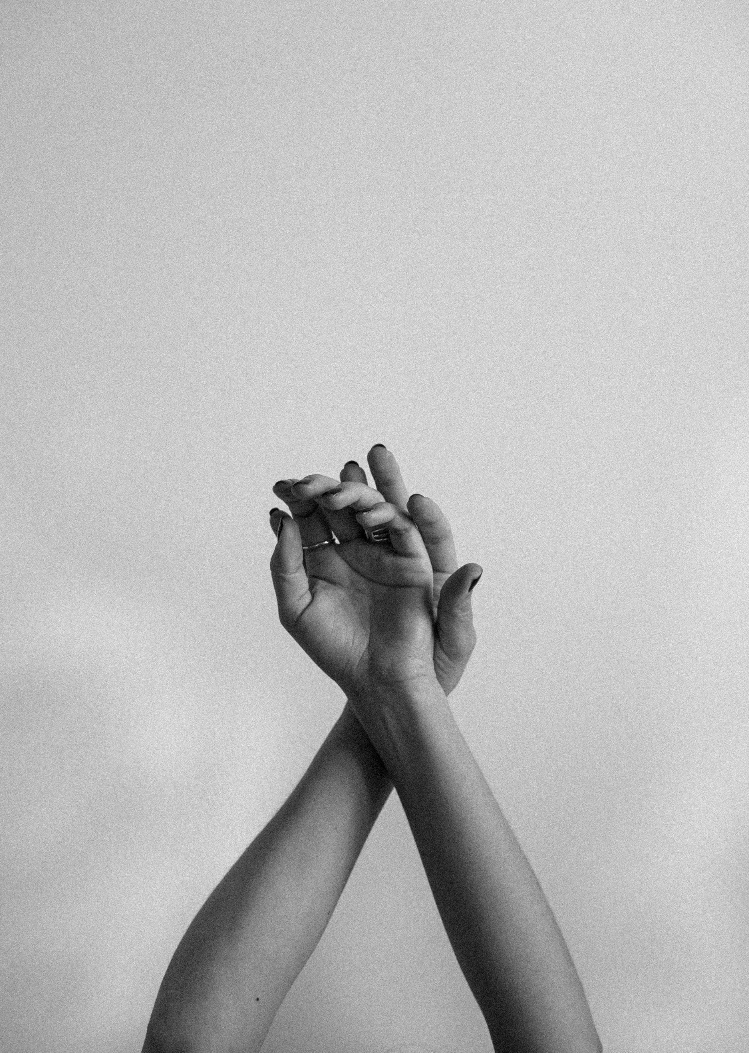 grayscale photo of persons hand