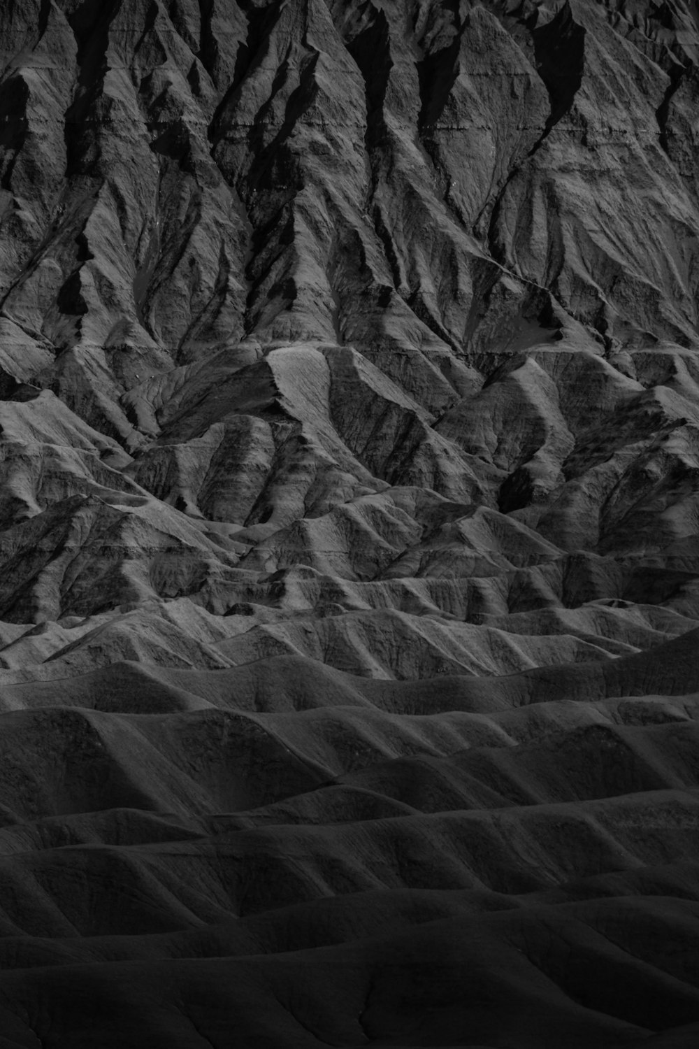 grayscale photo of rock formation