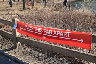 red and white wooden signage