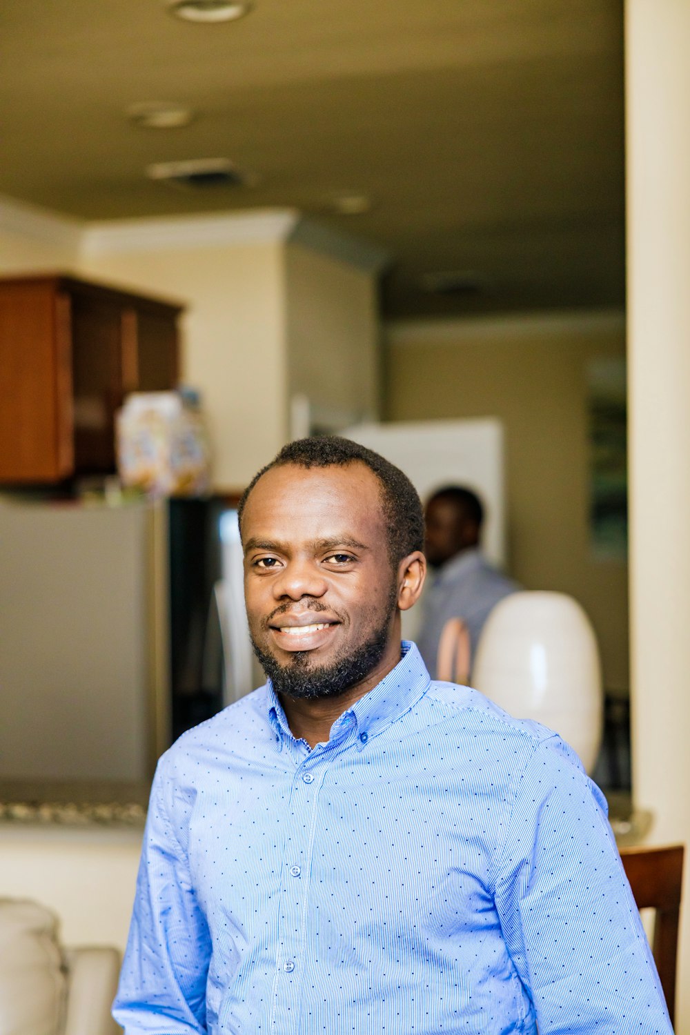 man in blue dress shirt