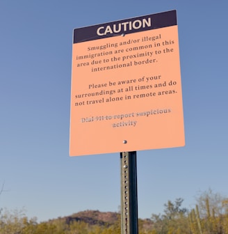 a caution sign in the middle of a desert