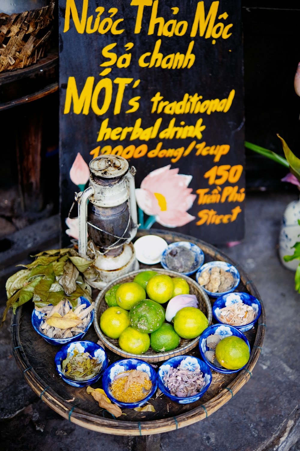 a plate of food on a table with a sign in the background