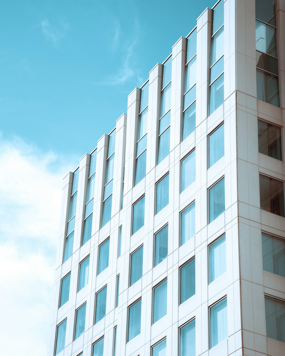 white concrete building under blue sky during daytime