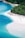 A stunning beach with clear turquoise waters and white sand.