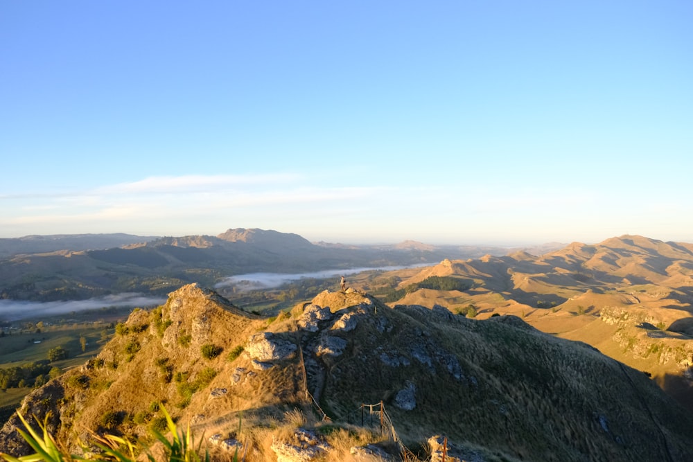 green and brown mountains under blue sky during daytime