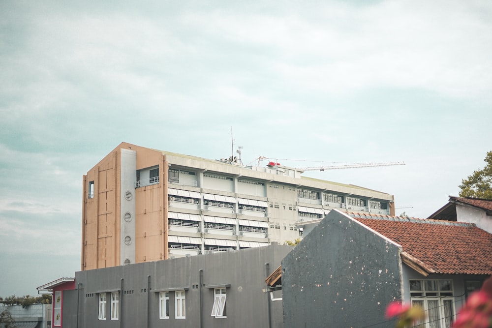 white and brown concrete building under white sky during daytime