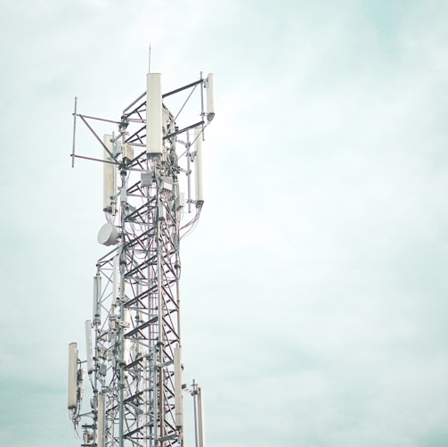 gray metal tower under white sky