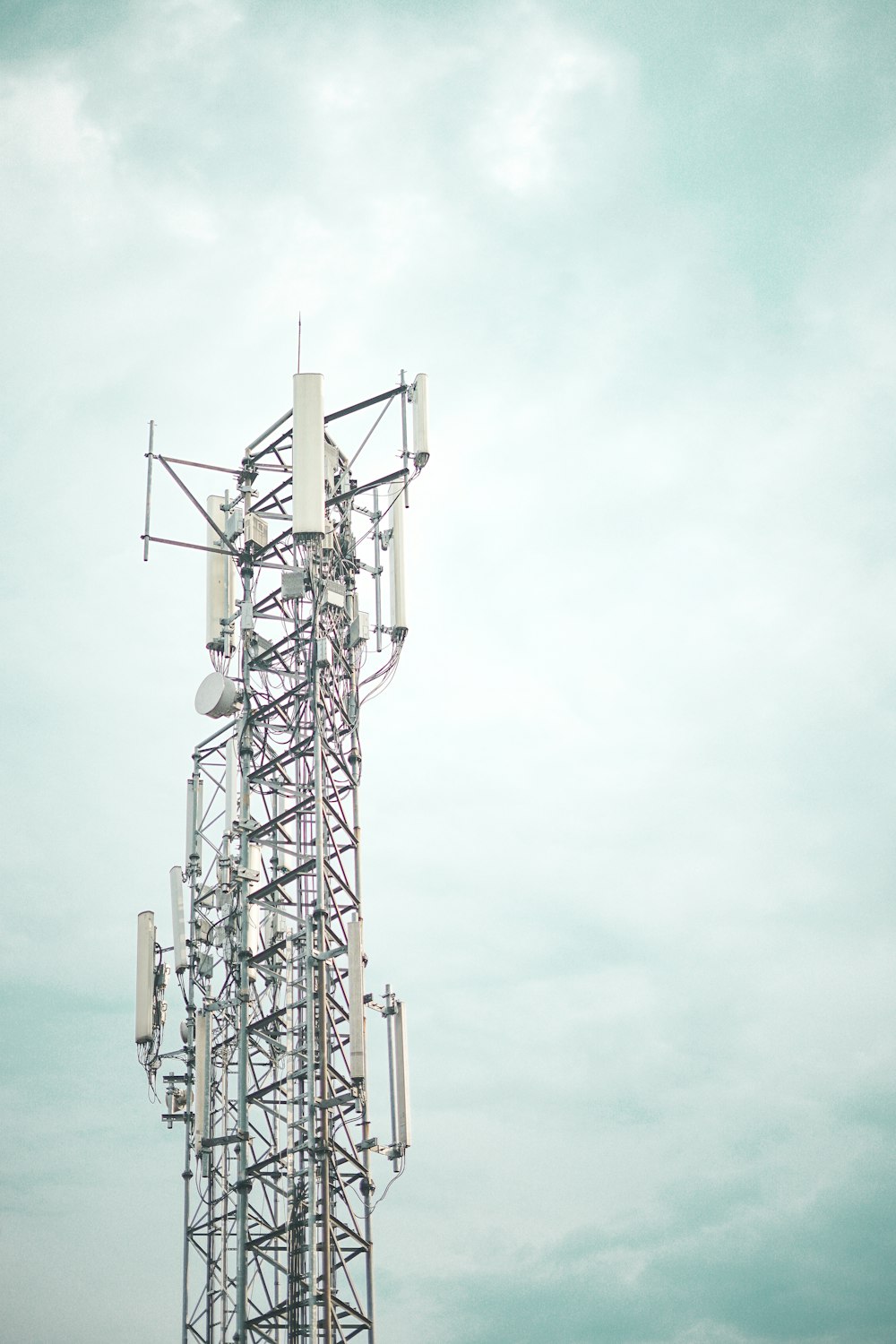 gray metal tower under white sky