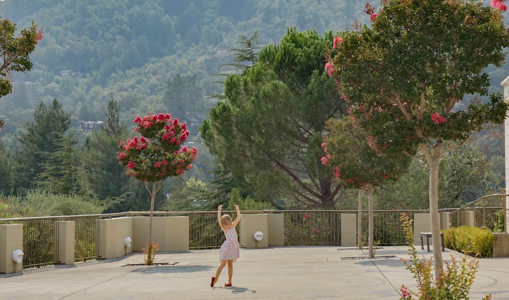 girl in pink dress standing on basketball court