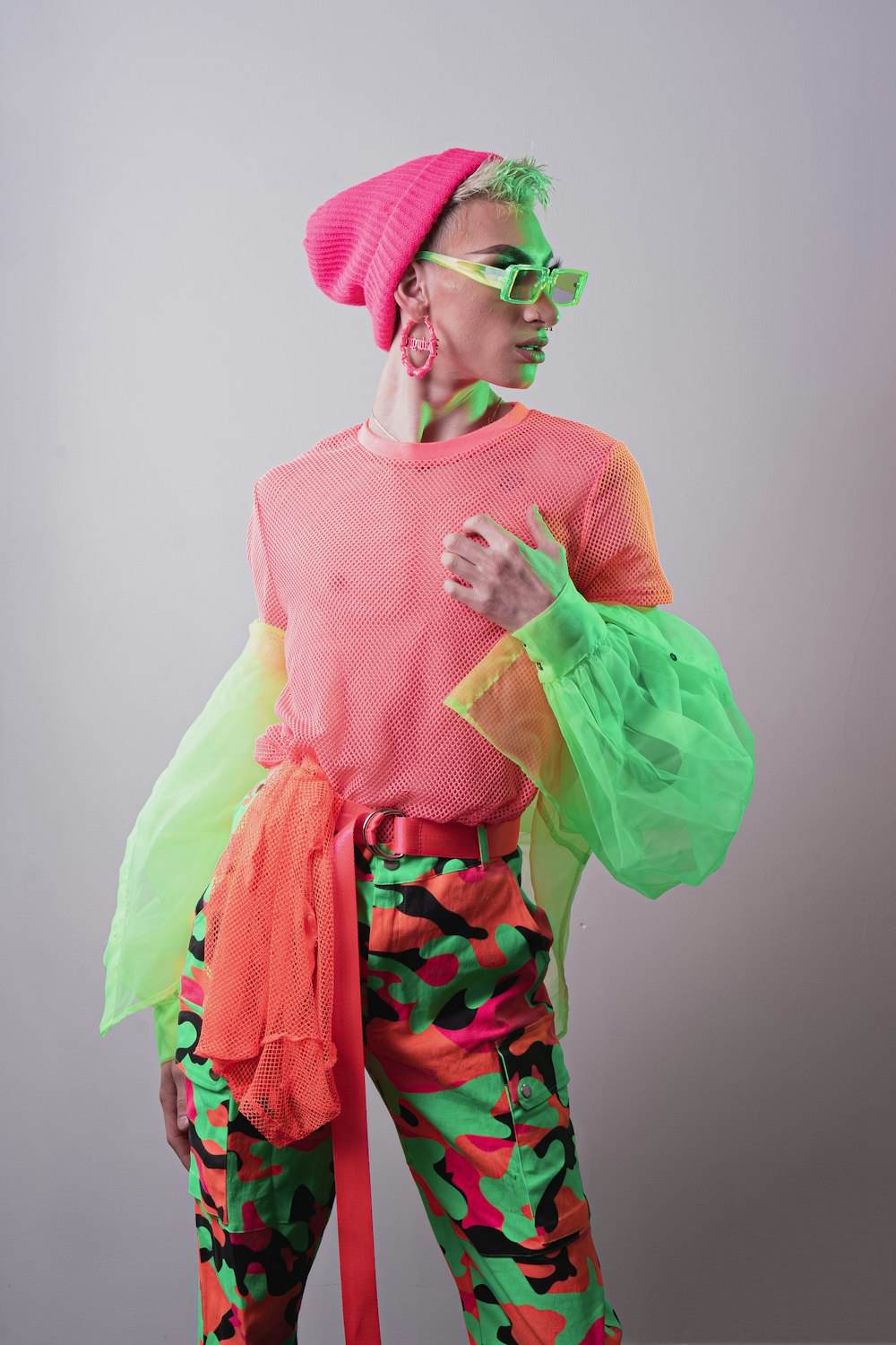 woman in pink and green floral dress