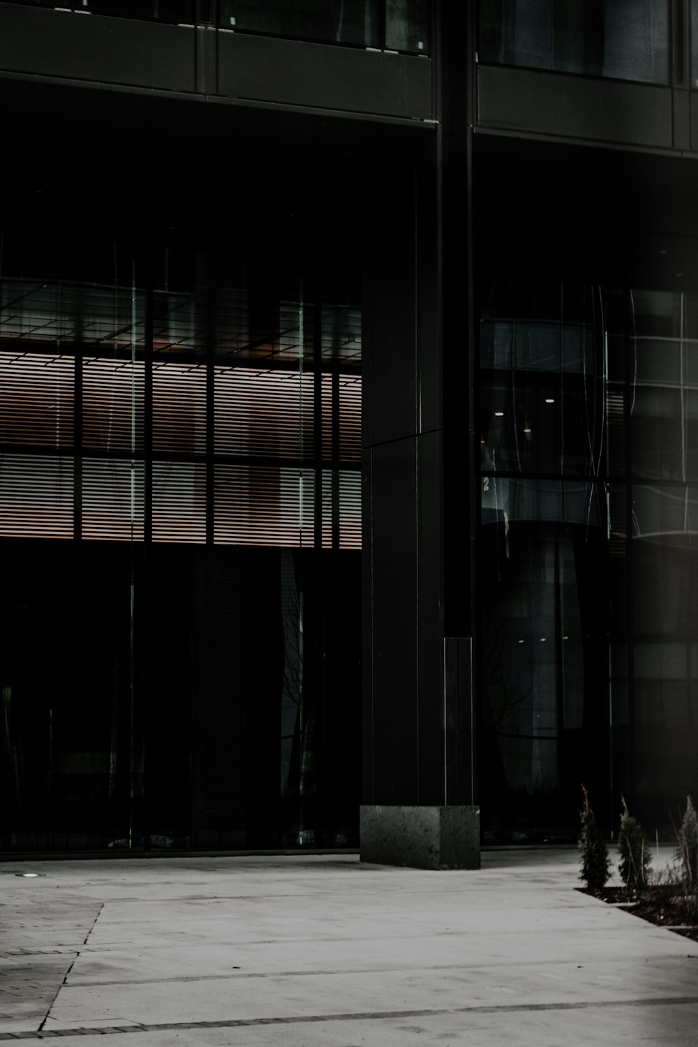 person in black jacket standing near building during daytime