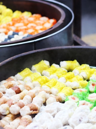 sliced fruits on black round pan