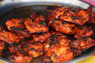 A sizzling plate of chicken tikka, marinated in spices and grilled to perfection.