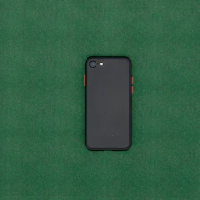 Hands testing speaker and microphone functionality on a Tecno smartphone.
