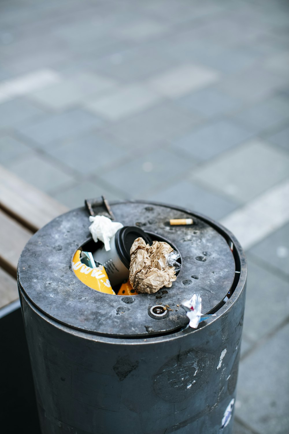 cigarette butts on black round ashtray