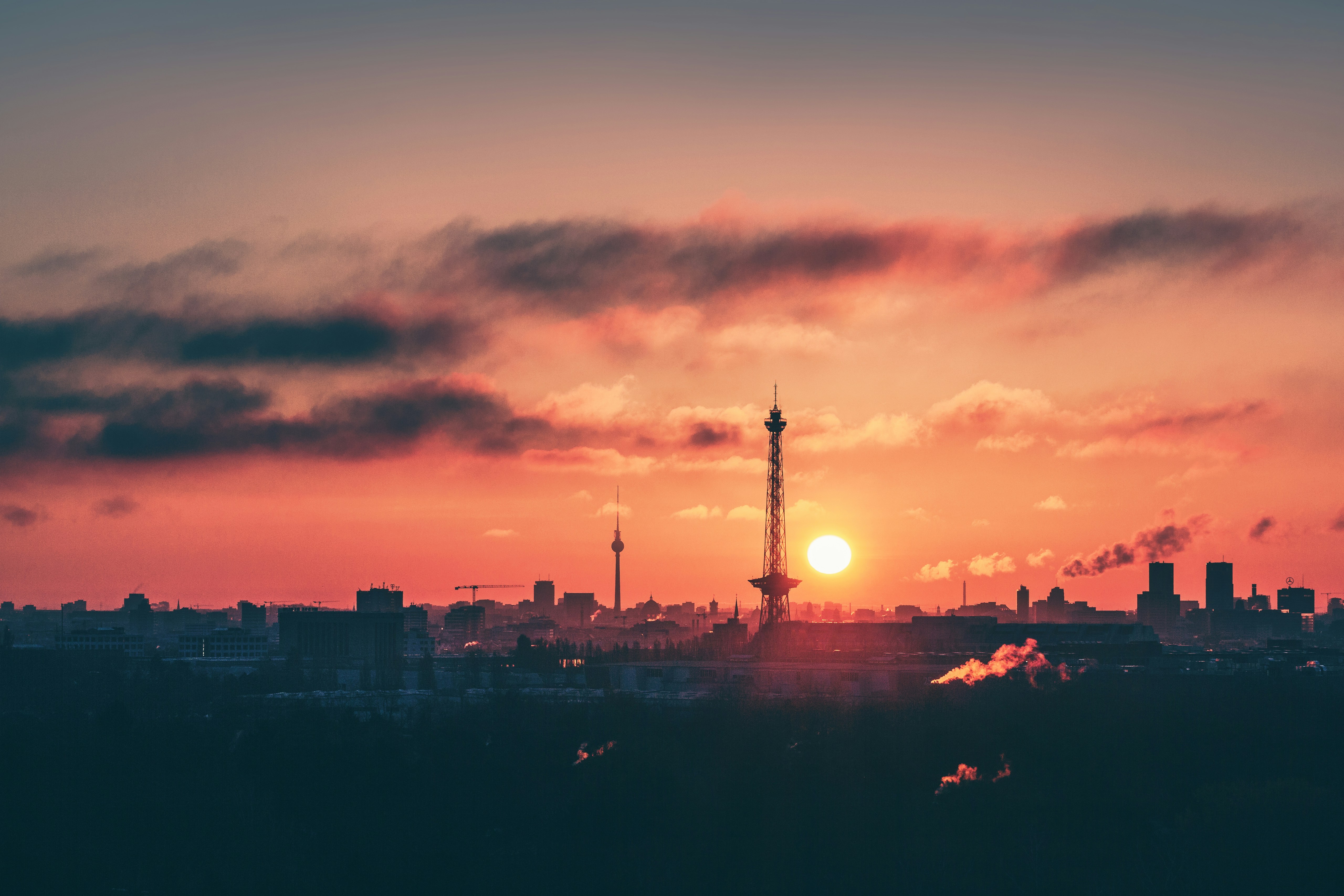 silhouette of city buildings during sunset