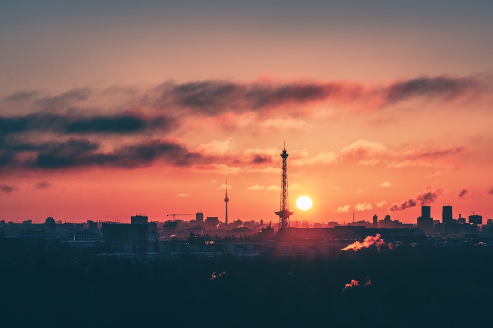 silhouette of city buildings during sunset