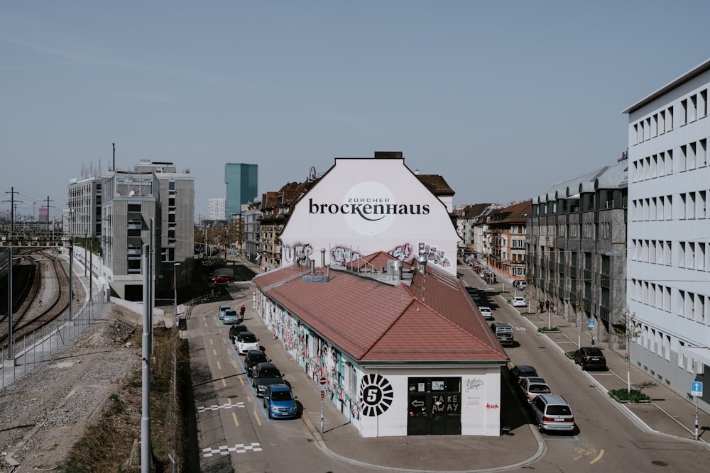 a large white building with a red roof