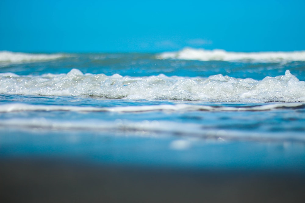 water waves on blue sea during daytime