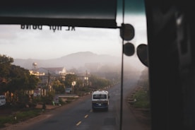 A scenic morning route showing a school bus driving through a quiet neighborhood.