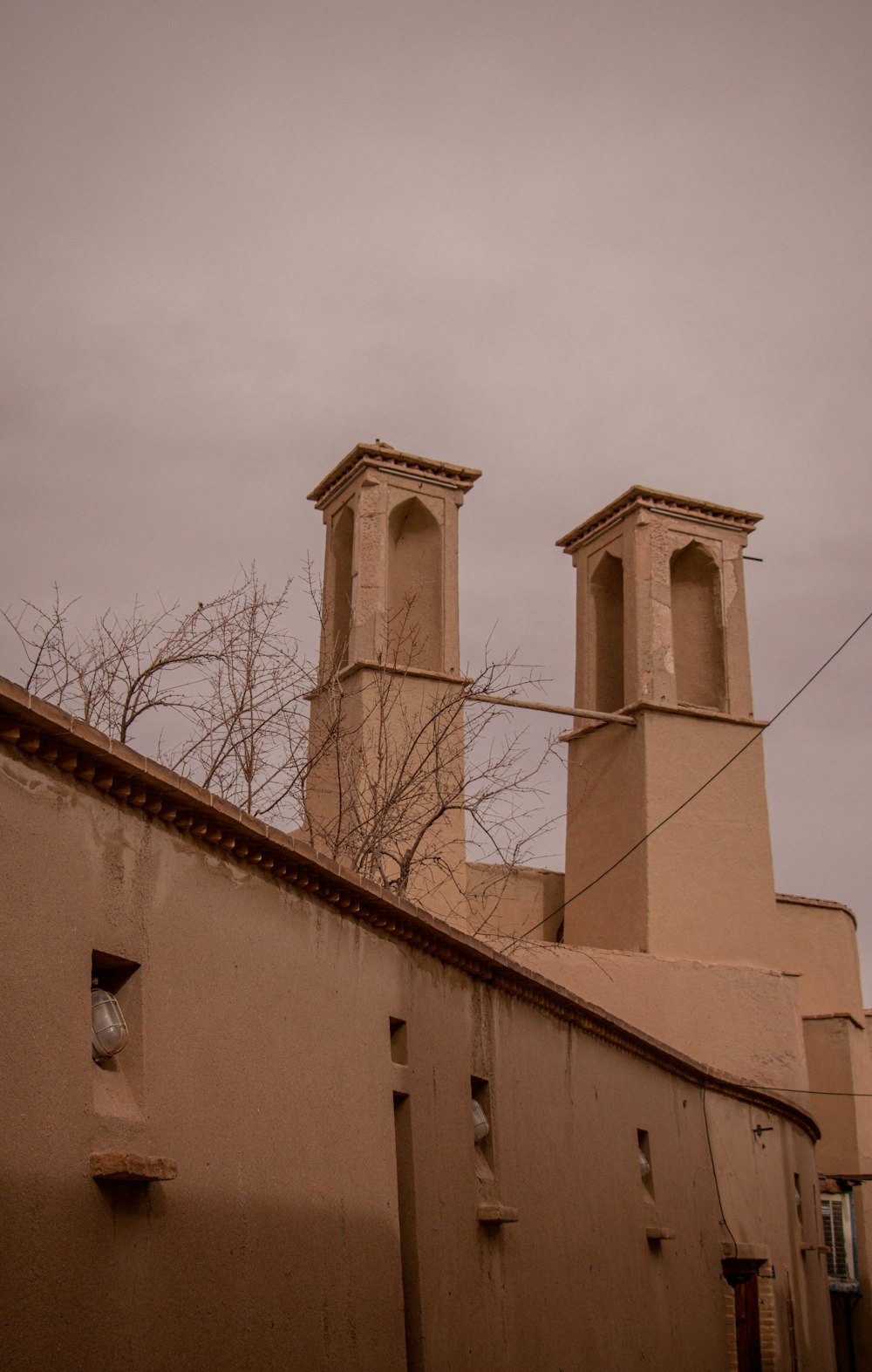 brown concrete building under white sky during daytime