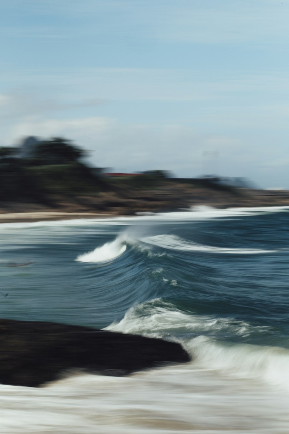 person surfing on sea waves during daytime