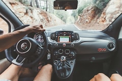 person driving car during daytime