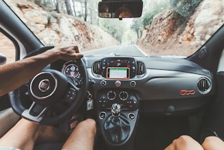 person driving car during daytime through the Sierra de Tramuntana Mallorca