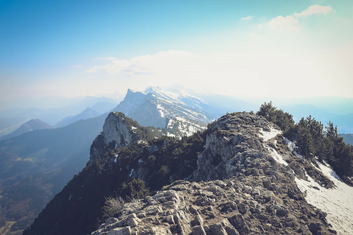 A rocky ridge on Le Moucherotte with snowy peaks behind
