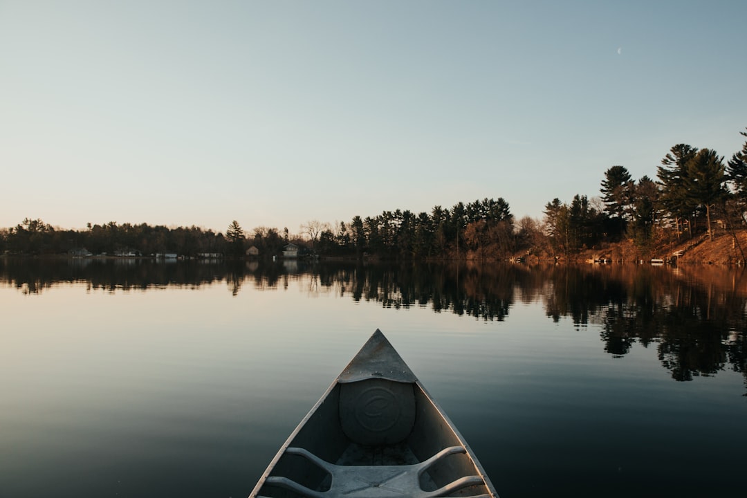 brown canoe on lake during daytime