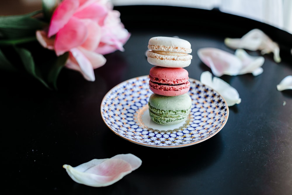 pink and white cupcake on white ceramic saucer