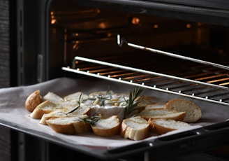 bread with meat on black tray