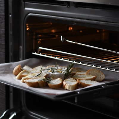 bread with meat on black tray