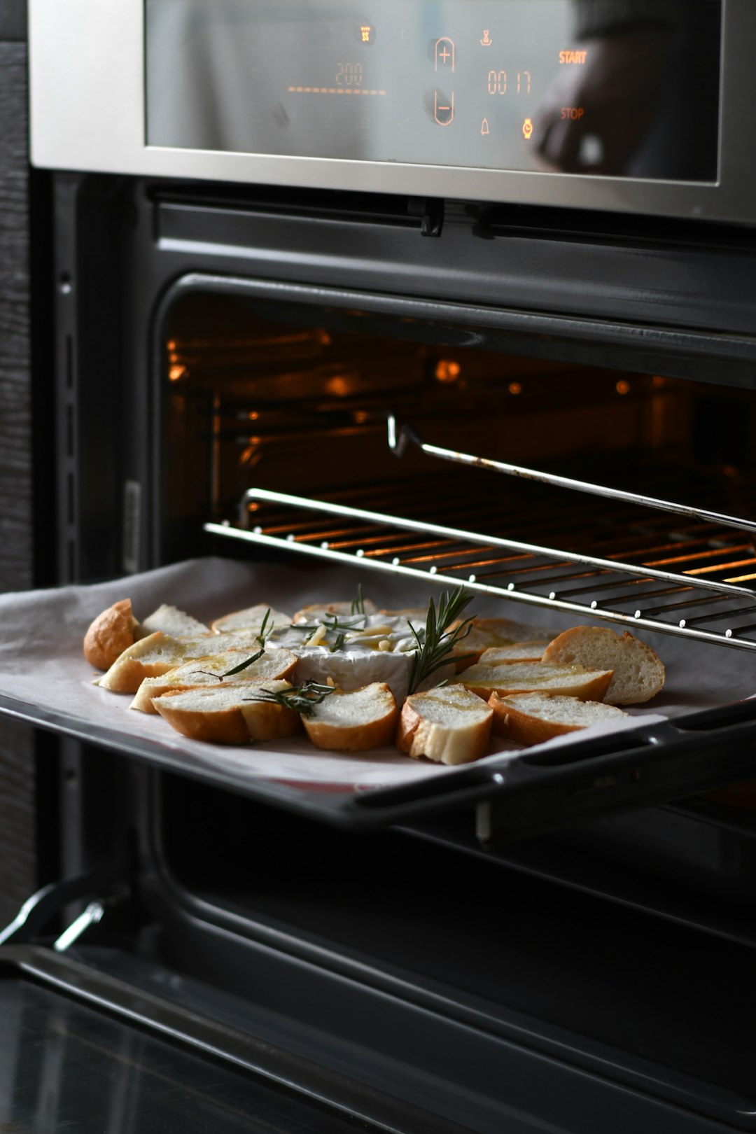  bread with meat on black tray oven