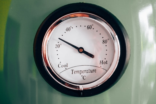 black and white analog clock at 10 00