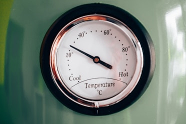 black and white analog clock at 10 00